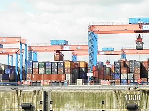 Numerous containers are standing in a container port